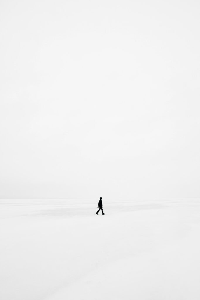 person walking on snowfield